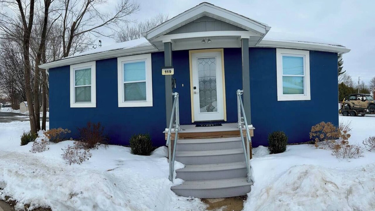 Oconto House | The Blue Riverside Home in Oconto