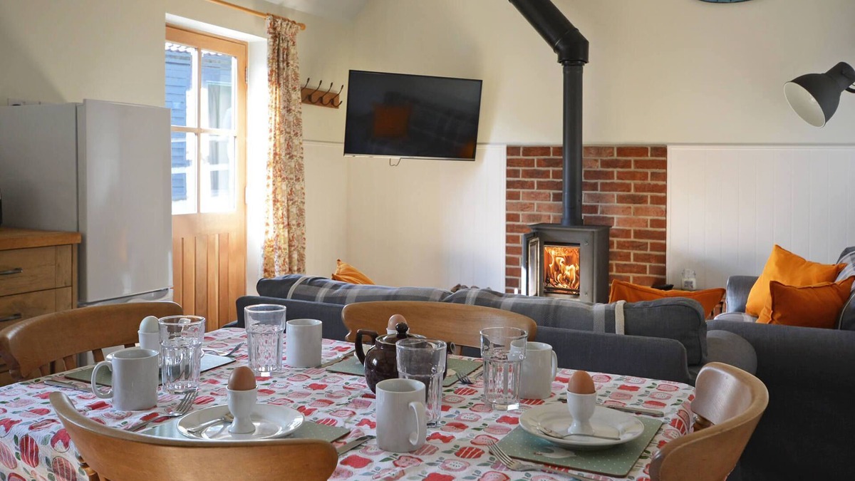 Nunney House | The Old Parlour - timber clad cosy converted cow shed