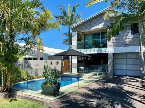 Mudjimba House | The Palm - Beachside Home with Heated Pool, Cinema & Games Room