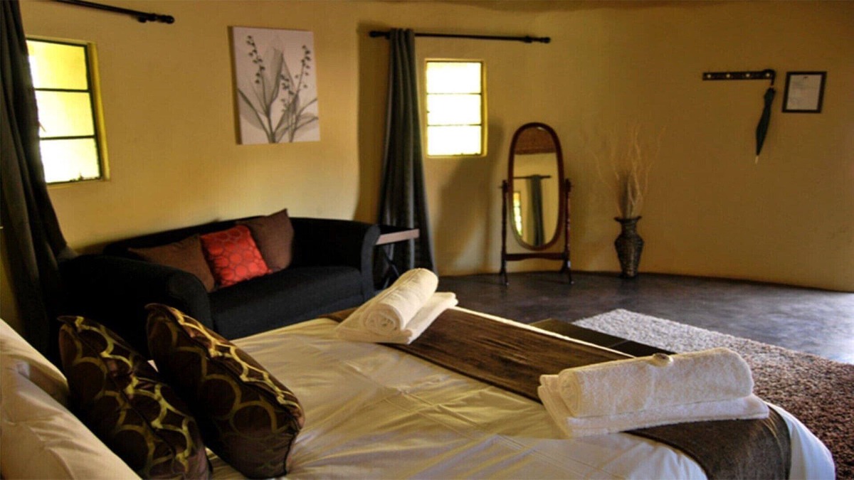 Leribe District House | The Queen-Size-Bed Riverside Huts