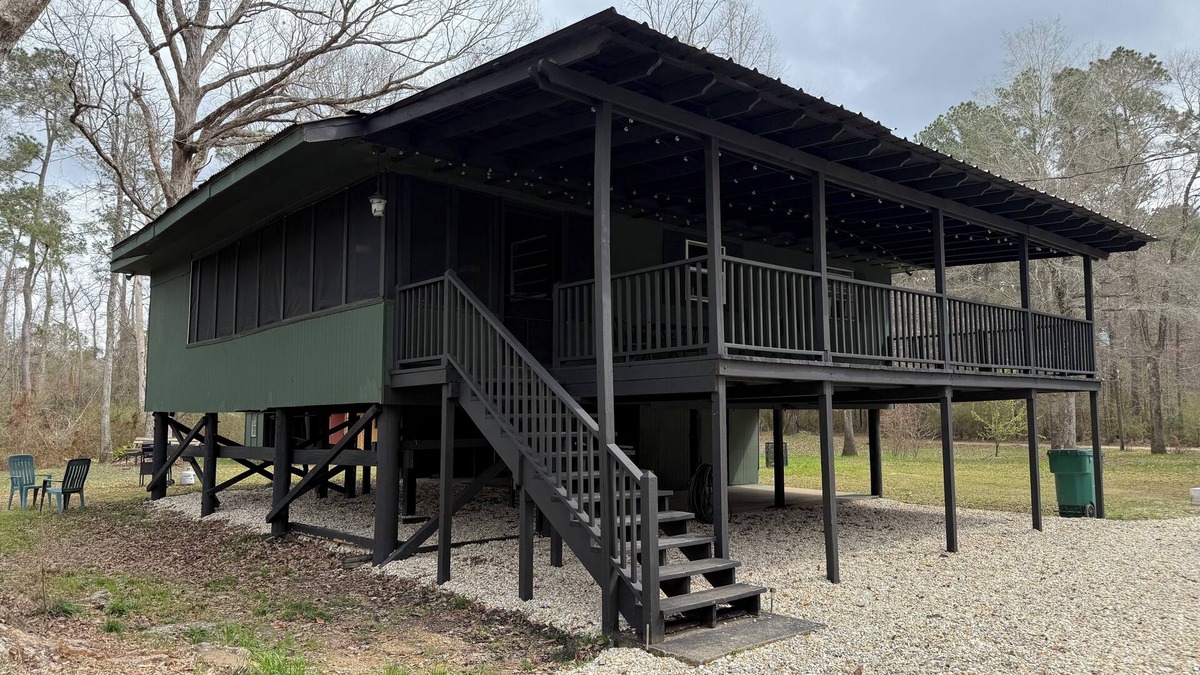 Fluker House | The Woods Camp w/fire pit, propane grill, and waterfront view on the River