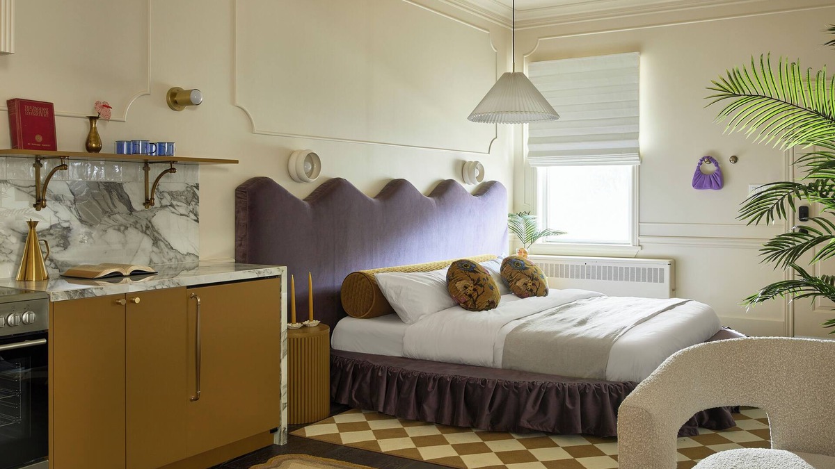 Stratford Hotel | This neutral flat packs a punch with a unique and interesting feature—a round king size bed!