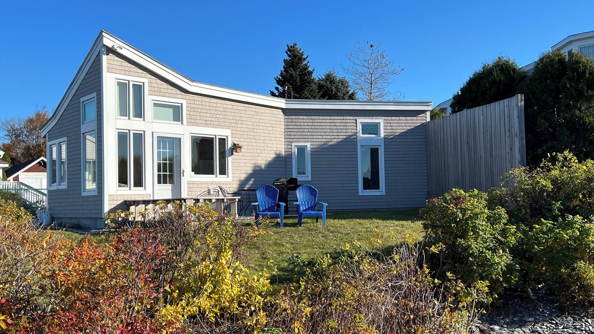 Mid-Coast and Islands Cottage | This sweet cottage offers a shared pebbly beachfront and gorgeous sunset views