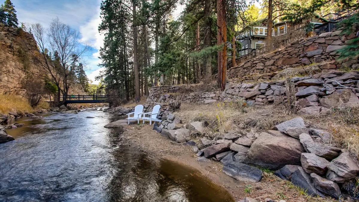 Evergreen House | Timeless 100 Year Old Creekside Cabin near Red Rocks. King size bed.