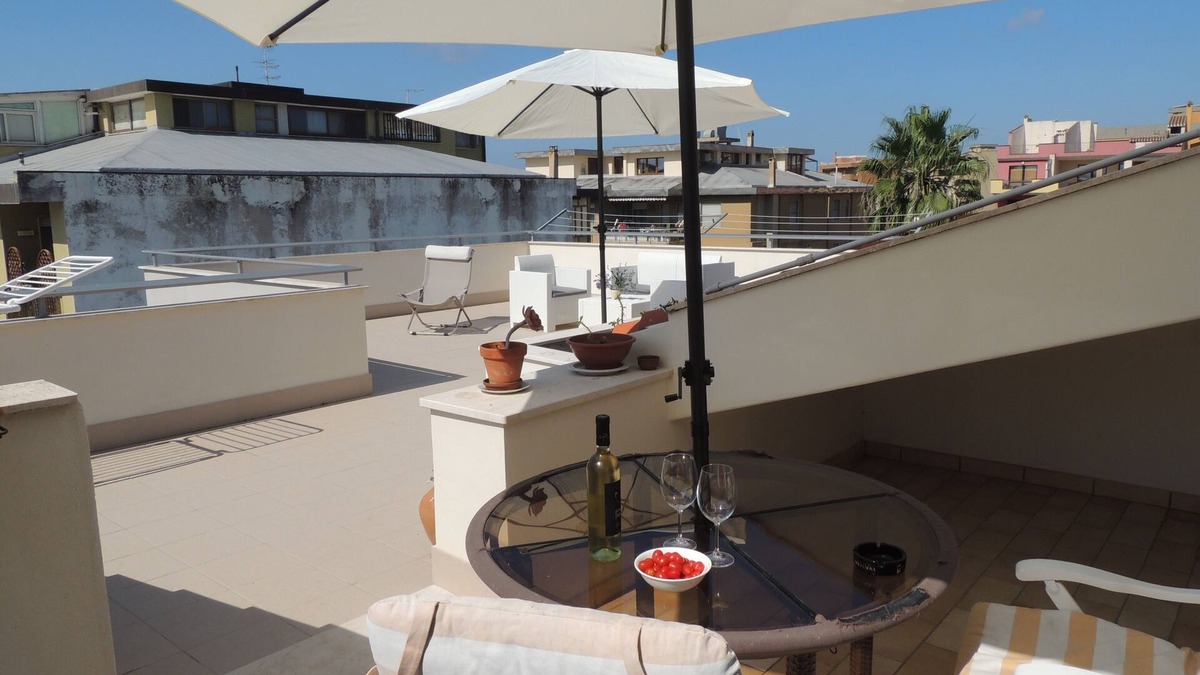 Oristano Apartment | Top floor penthouse apartment with terrace in the historical center, 3 km from the beach