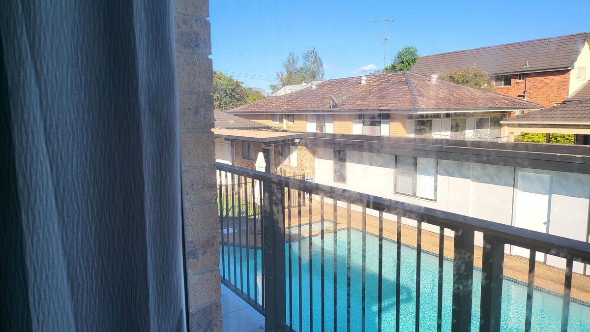 Windsor Apartment | Top View Deluxe Self-Contained Room No 3 with Balcony Overlooking Swimming Pool.