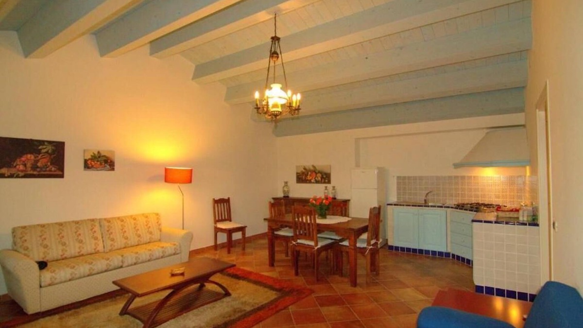 Carruba House | Torre Archirafi Resort -refuge nestled in the green Sicilian countryside.