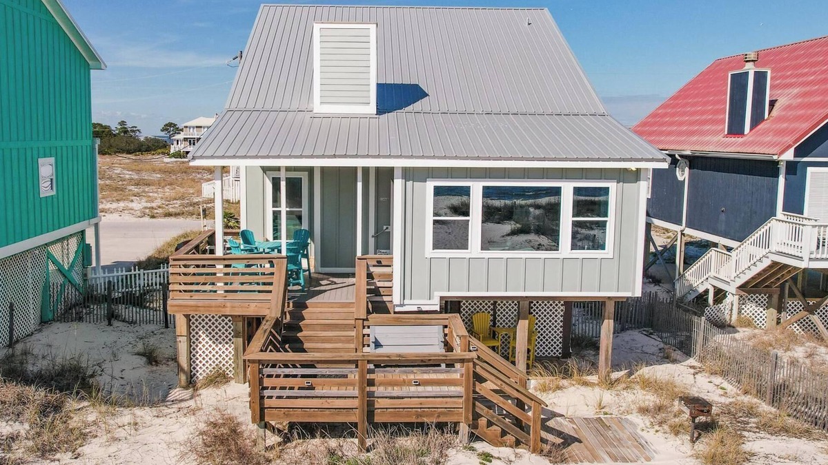 Fort Morgan House | Totally renovated 4 bedroom, 3 bath gulf front home with nice covered deck and large sun room.