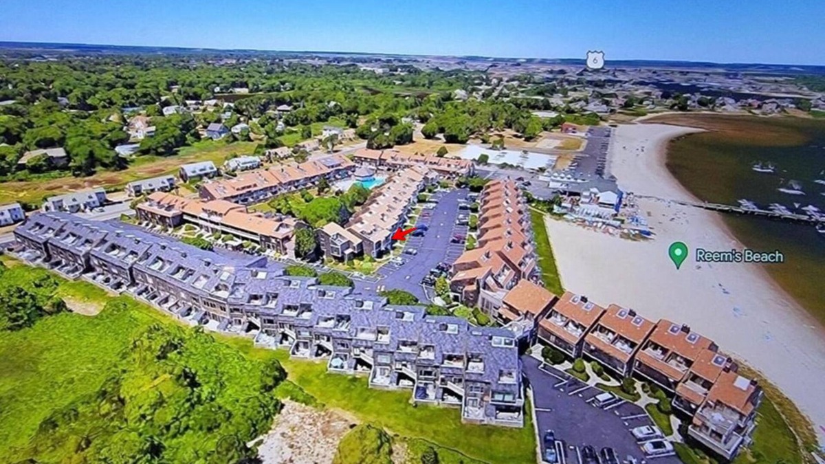 Hyannis House | Townhouse less than one-minute walk to a private beach and heated pool on site
