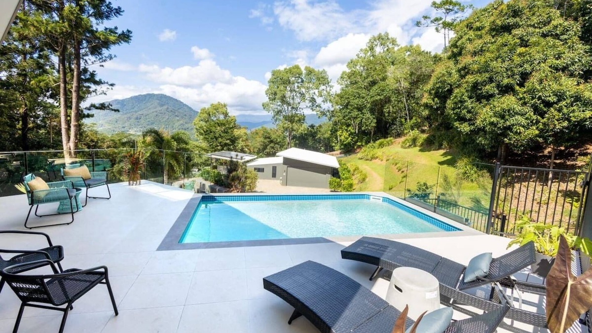Brinsmead House | Treetops Retreat: A Serene Rainforest Escape with Mountain Views