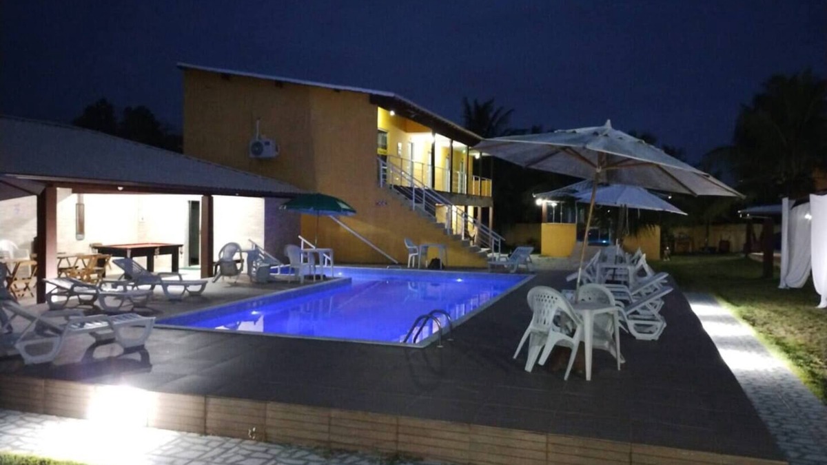 Barra Nova Apartment | Triple room with air conditioning and hammock on the balcony