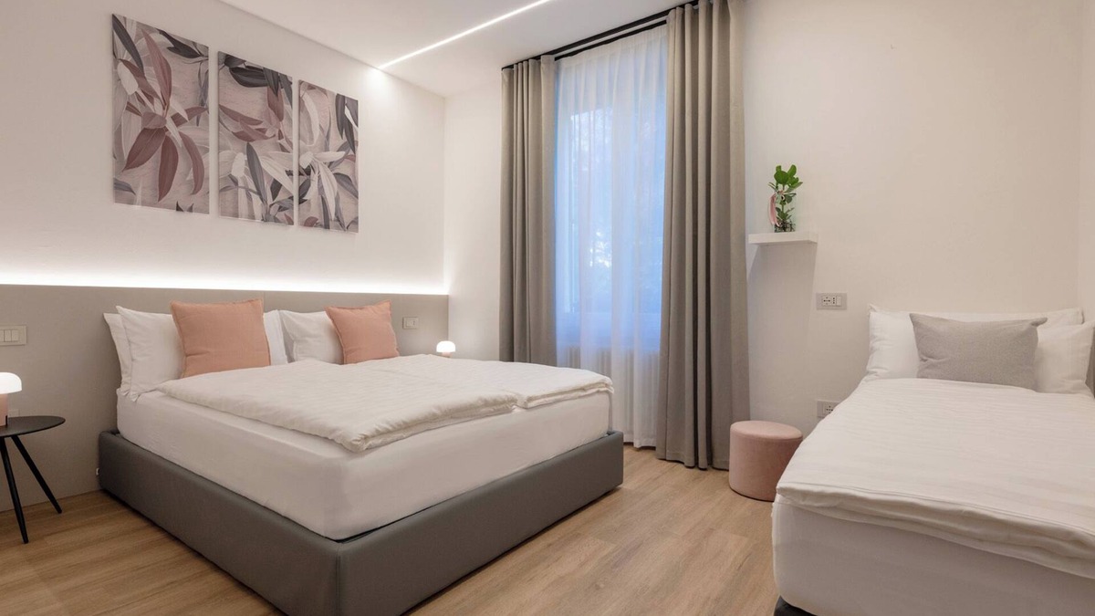 Trento House | Triple room consisting of double bed and single sofa bed