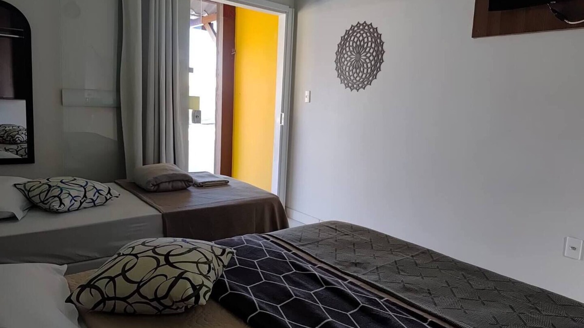 Barra Nova Apartment | Triple suite with air conditioning, TV, minibar and private balcony with hammock