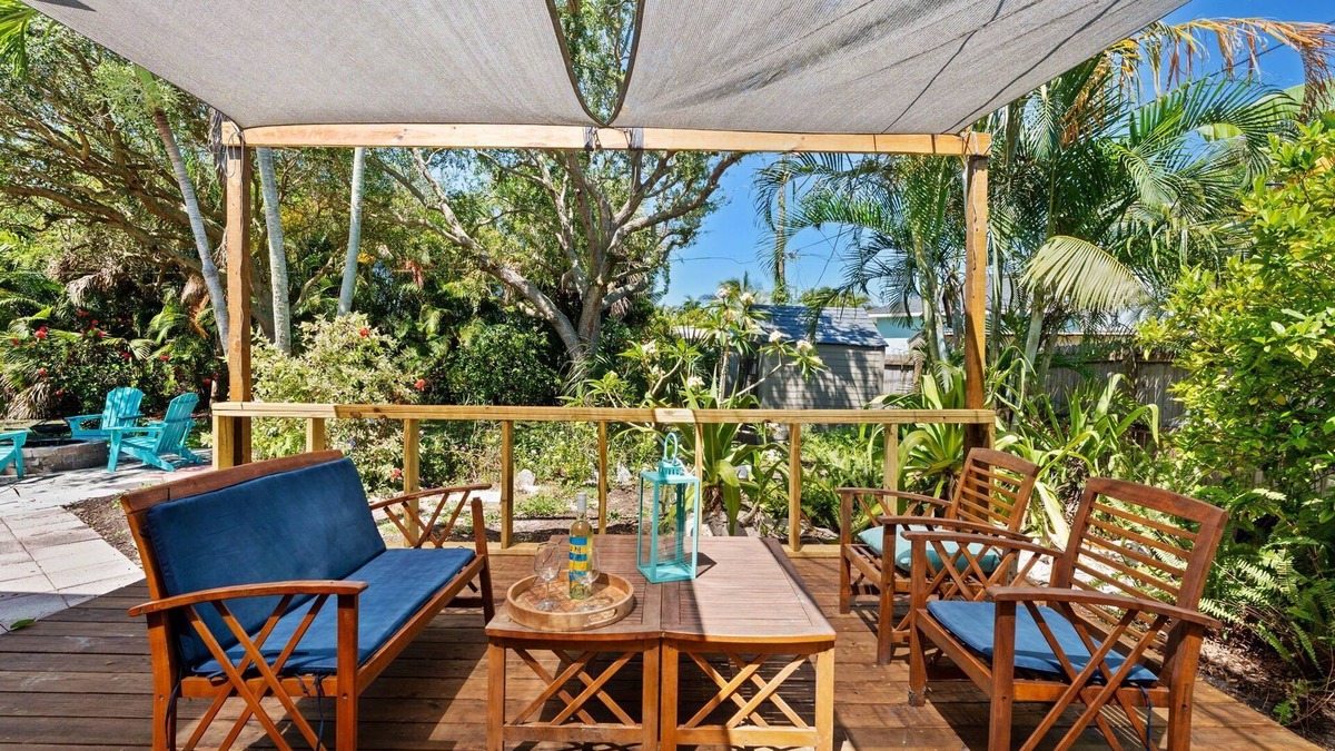 Snug Harbor Estates House | Tropical Beachside House w/Backyard Oasis, Fire Pit, BBQ & Outdoor Patio