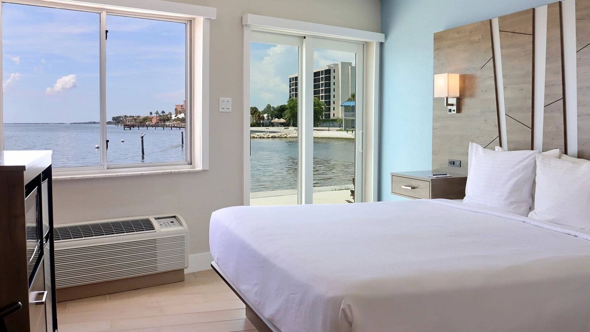 Pinellas Point House | Tropical Retreat: Outdoor Pools, Private Beach, Waterfront Dining