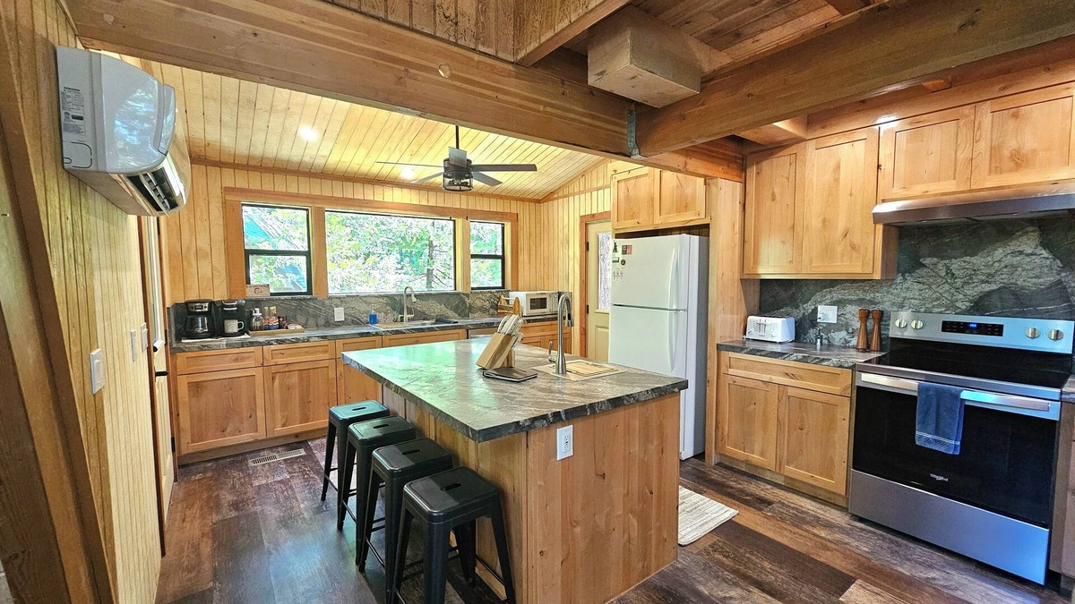 Sierra Cedars Cabin | Tucked in the trees, Cedar Hill is a cozy A-frame cabin with modern updates, a spacious kitchen, wraparound deck, and stunning views. The perfect mountain escape for families, couples, and friends—plus, it's pet-friendly!