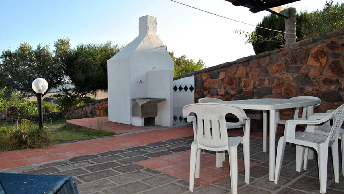 Sant'Antioco Villa | Two adjoining apartments sleeps 8/10, veranda, barbecue and olive garden