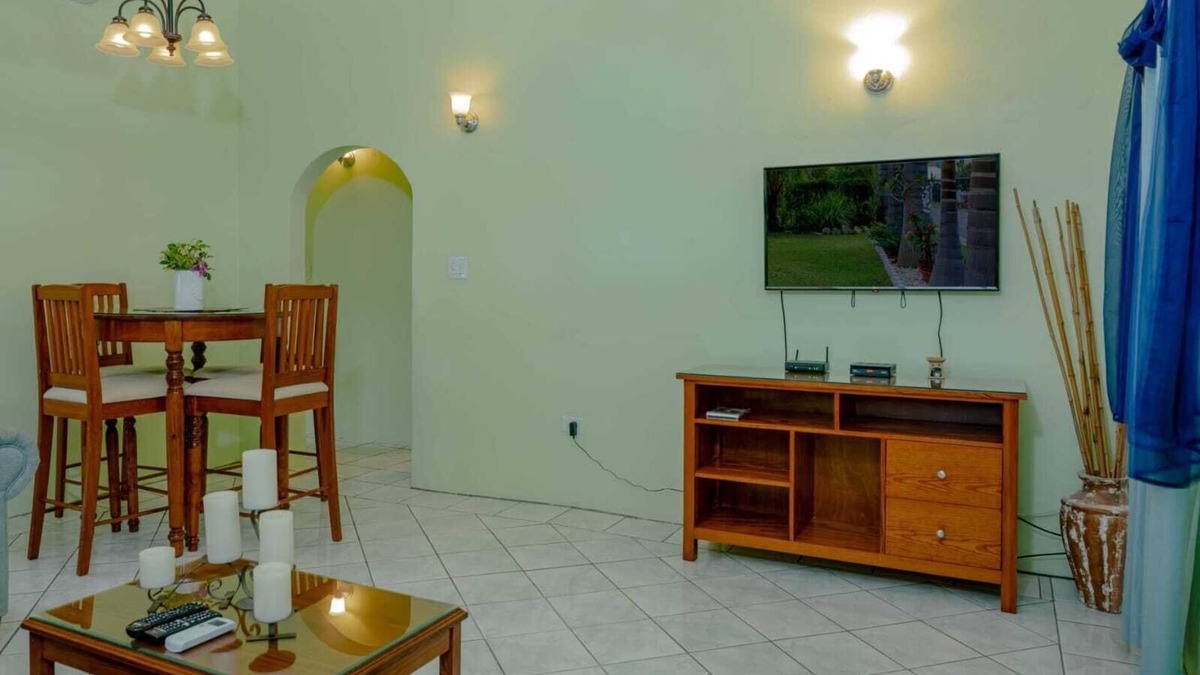 Cades Bay House | Two bedroom, 2 bathroom house in a tropical palm and garden setting.