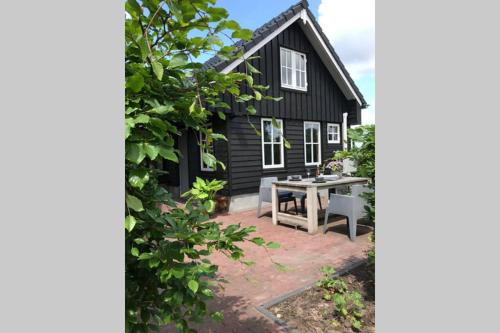 Hollandsche Rading Apartment | Uniek houten huis nabij bos en plassen