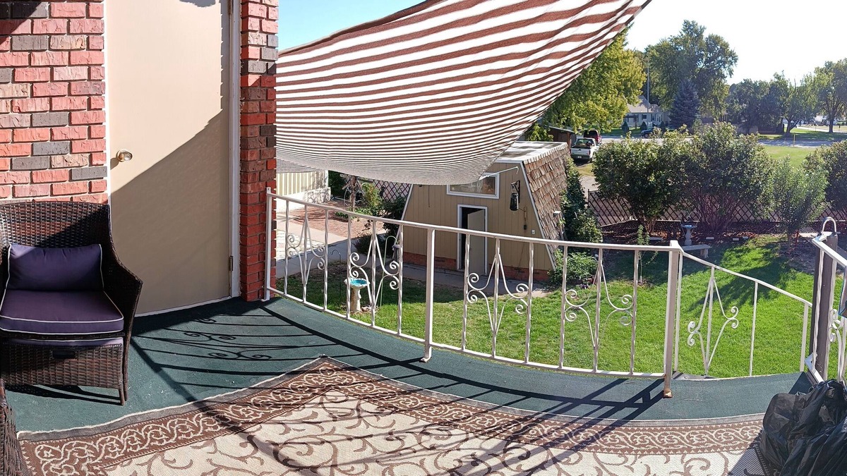 Holdrege Apartment | Uniquely comfy 2nd story, private entrance, outdoor balcony, fence, off street