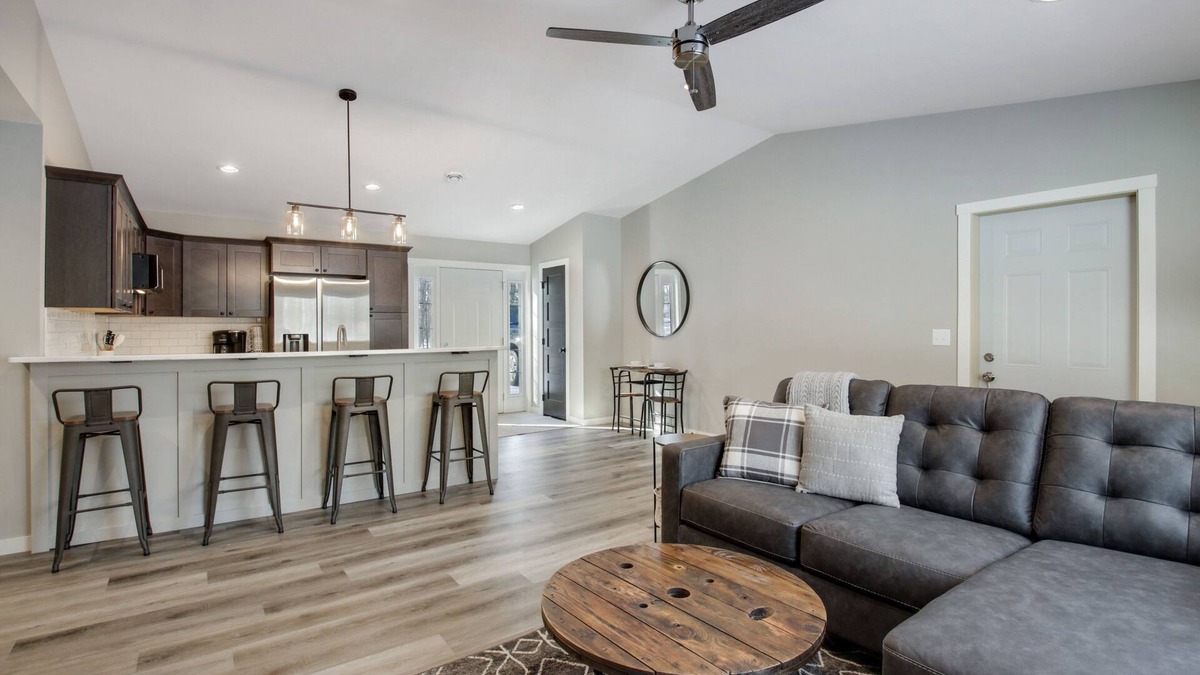 Cumberland Condo | Up North Living! Fully renovated one-level living home in wooded lot near lake.