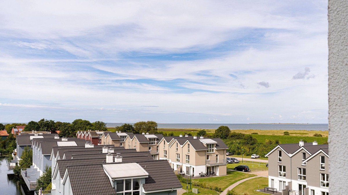 Schillig Apartment | Vacation apartment with a view of the sea and meadows, sauna & electric fireplace for relax