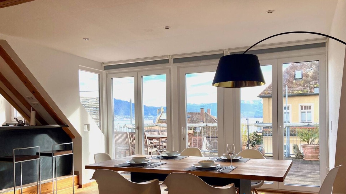 Insel Apartment | Vacation apartment with lake view - maisonette with roof terrace in the old town house on the island