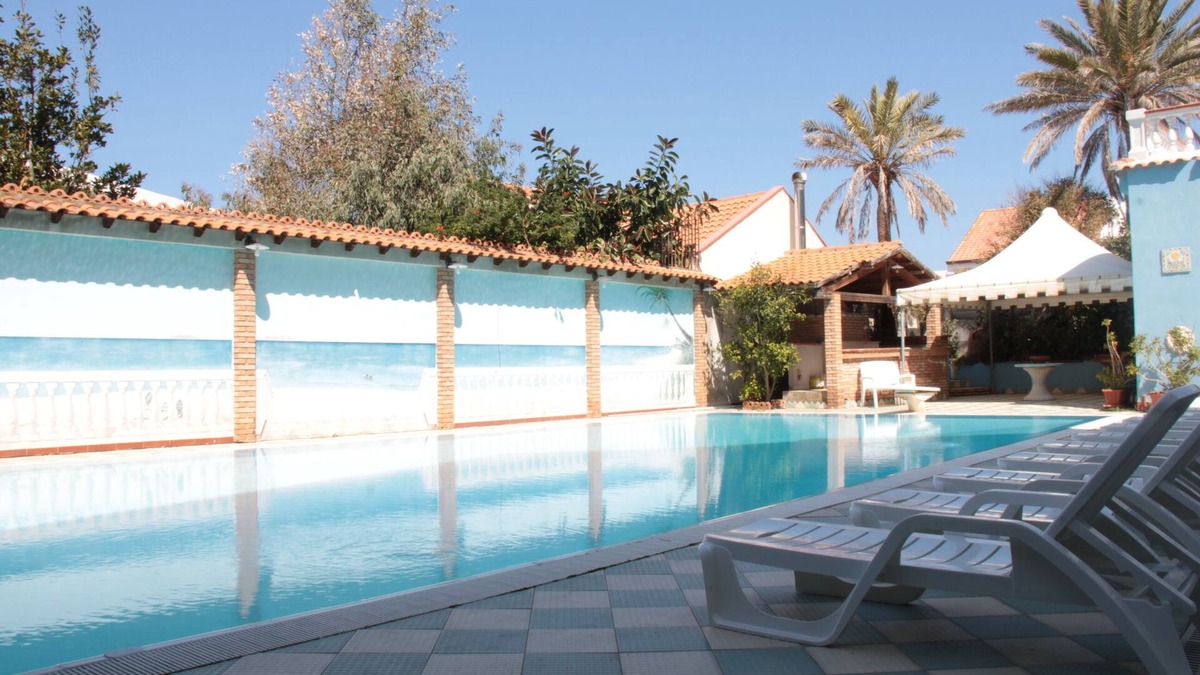Province of Messina House | Vacation Home "Oasi Azzurra - Bilocale Standard-103" with Shared Pool & 2 Shared Terraces
