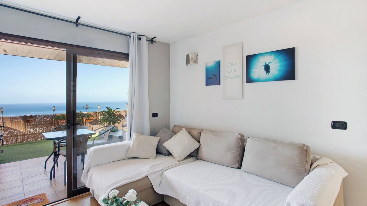 Puerto Rico Apartment | Vacation Home "Sunset" with Sea View, Shared Pool & Wi-Fi
