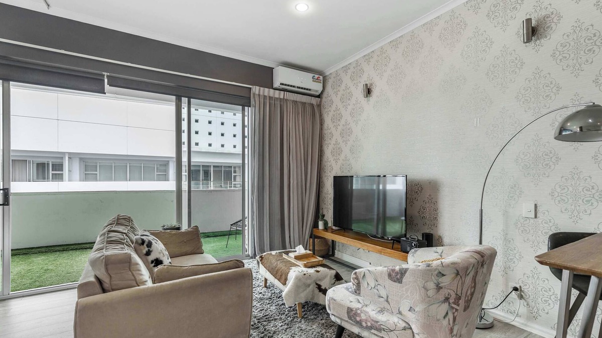 Auckland Central Business District Apartment | Viaduct apartment with a balcony by Zodiak Stays