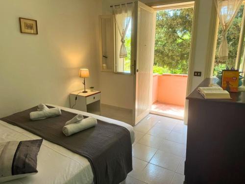 Tonnarella Apartment | Villaggio Portorosa - La casetta tra le palme 18