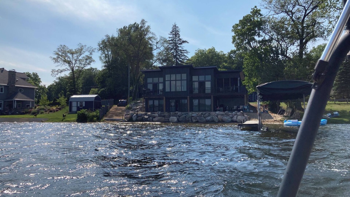 Delton House | Wall Lake Modern Home swimmable beach and paddle boat