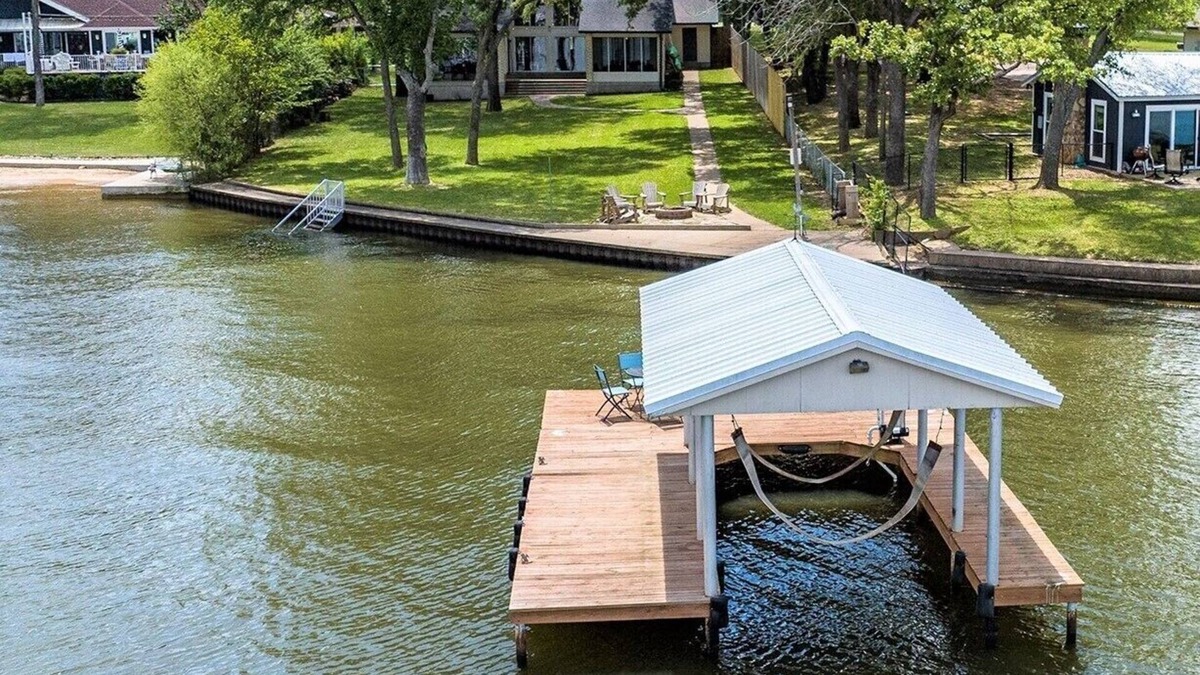 Cedar Creek Reservoir House | Waterfront 1 level Lakehouse with 108' of Unobstructed Views & HUGE Shaded Yard