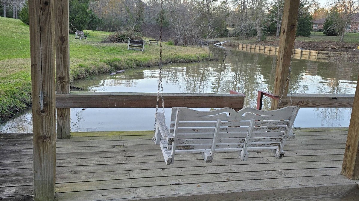 West Livingston House | Waterfront 4-bedroom estate with Indoor Pool and covered fishing dock Fire Pit