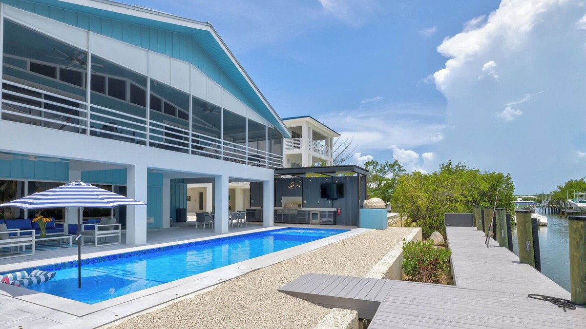 Pirates Cove House | Waterfront bayside oasis w/dock, pool, outdoor kitchen, pizza oven & fun