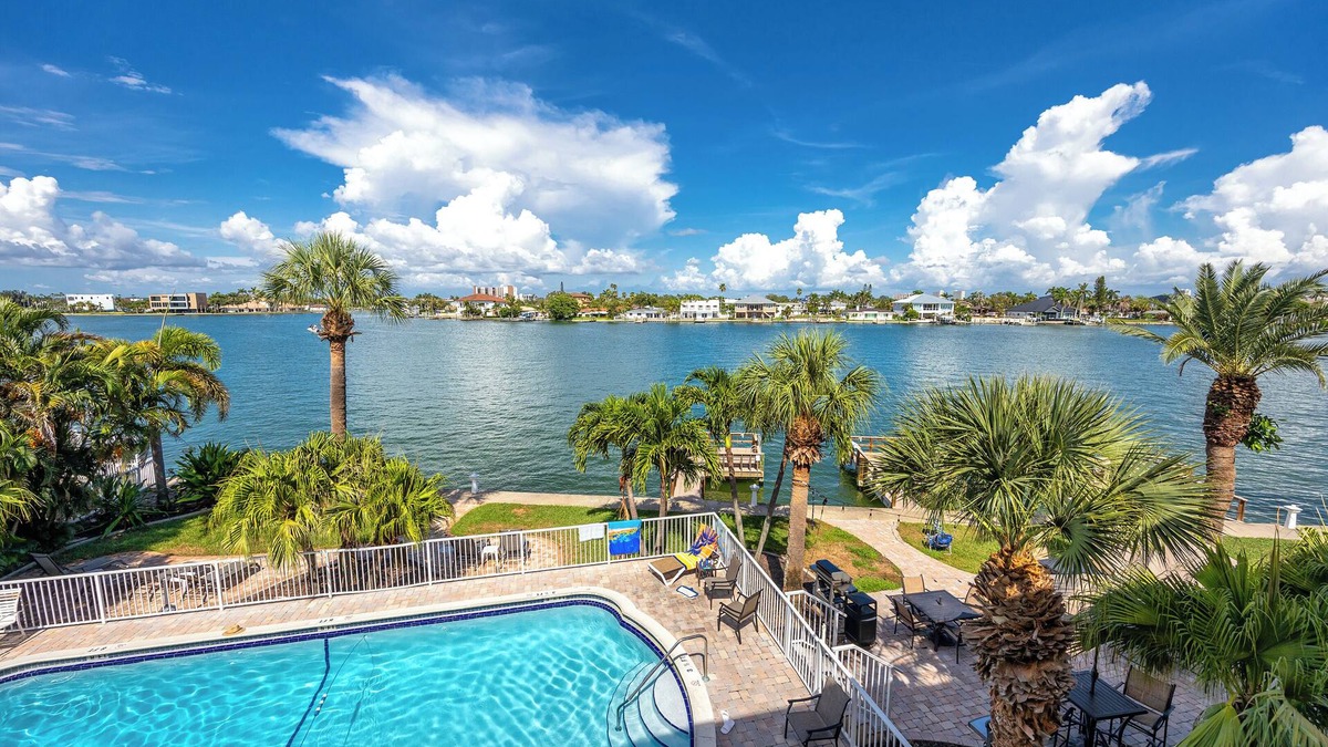 Treasure Island Condo | Waterfront Condo Pool Fishing Docks Across from the Beach