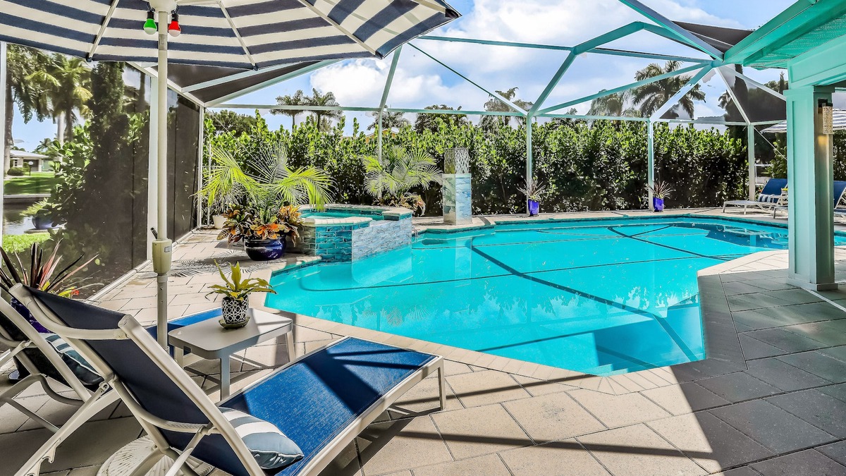 Yacht Club House | Waterfront escape in the heart of the action with pool, spa, grill, & WiFi