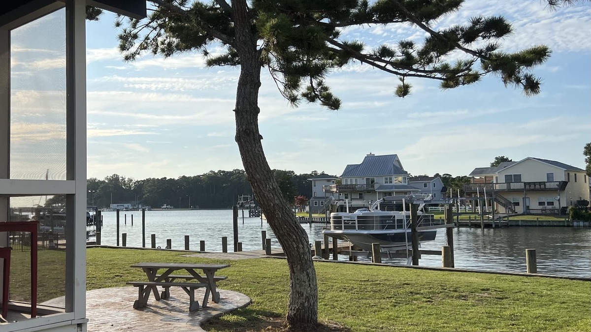 Colington Harbour Cottage | Waterfront Harbor Home, Sunset Views, Fireplace, Private dock and Boat Slip