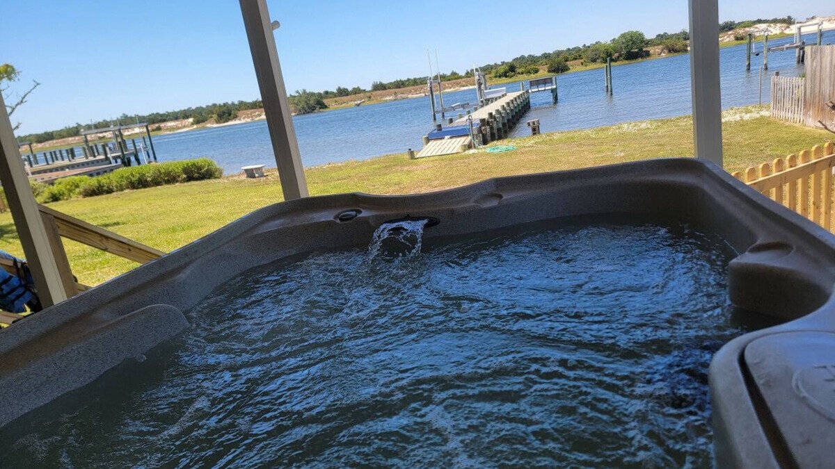 Cedar Point House | Waterfront home with Private Dock, 3 miles to Beach, Hot tub, kayaks, and swimming area, large fenced backyard, pet friendly