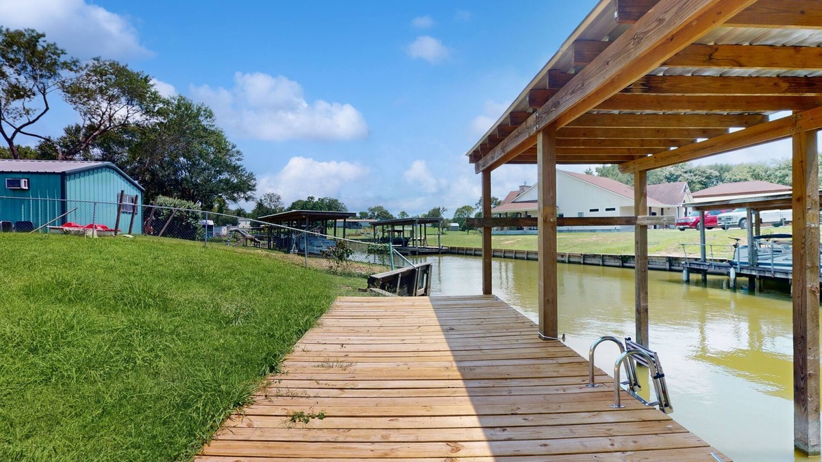 West Livingston House | Waterfront home with private deck, washer & dryer, and internet