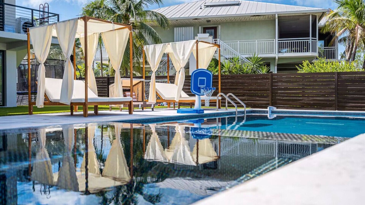 Rock Harbor Villa | Waterfront Luxe Pool, Hot Tub, Theater, Games and More!