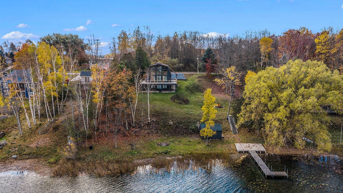 Scottville House | Waterfront Nordic Lodge on All Sports Lake, come with the whole family.