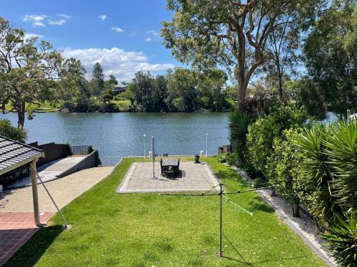 Dora Creek House | Waterfront Paradise with Jetty, BBQ, Pool table, & more