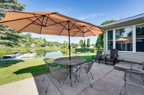 Reed City House | Waterfront Retreat with Dock and Yard in Reed City!