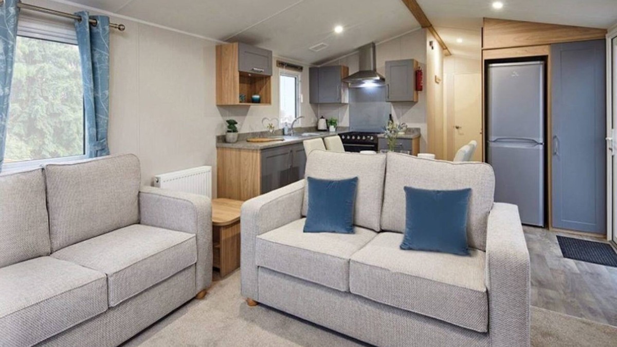 Dunbar House | Well appointed caravan with patio doors and decking.