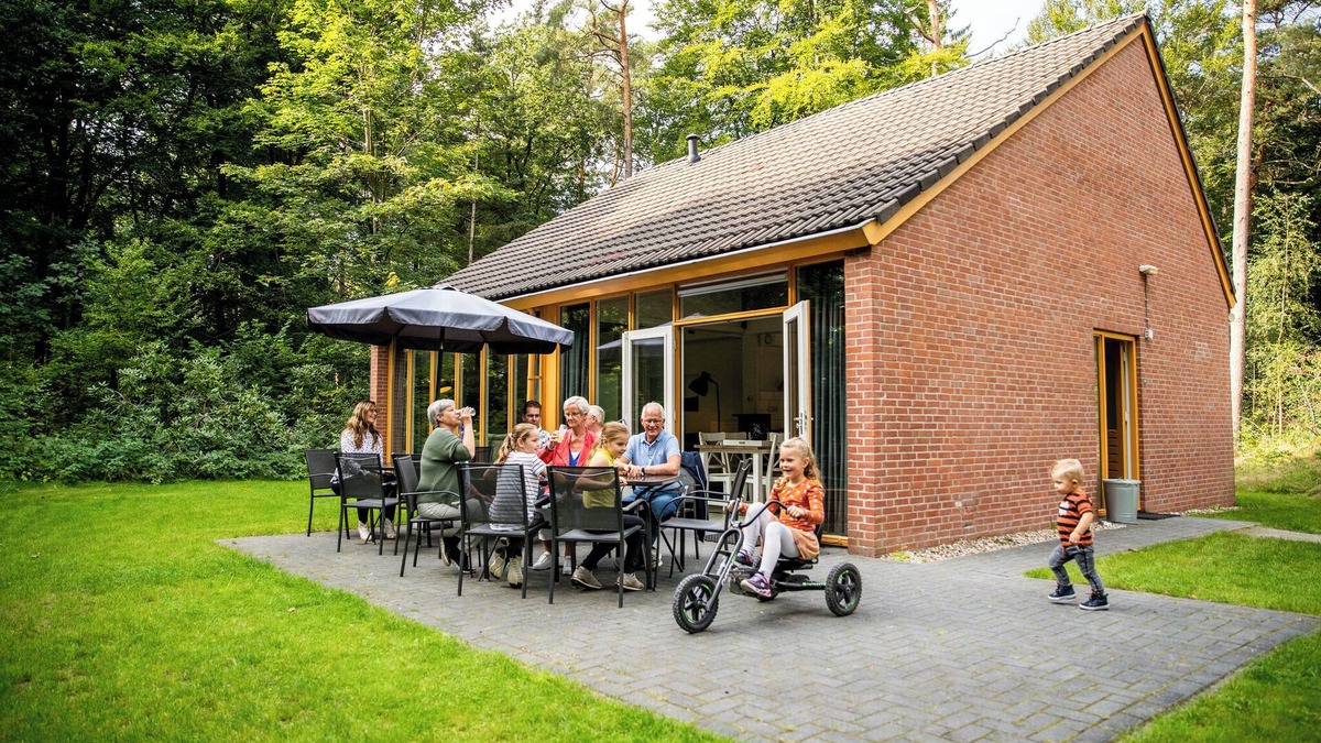 Norg House | When staying in this 12-person bungalow, you don't have a garden, but a whole forest! On the terrace, you can enjoy the outdoors.
