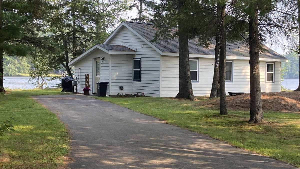 Rhinelander Cottage | WI River-Boom Lake cottage on spacious lot, water on 3 sides, kayaks, fire pit