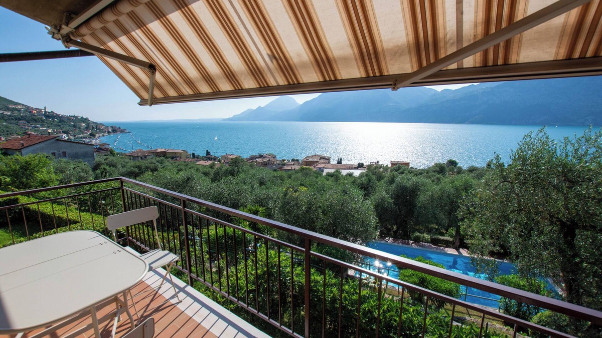 Assenza Apartment | Wonderful balcony on the lake with beautiful pool and garden among palm and olive trees