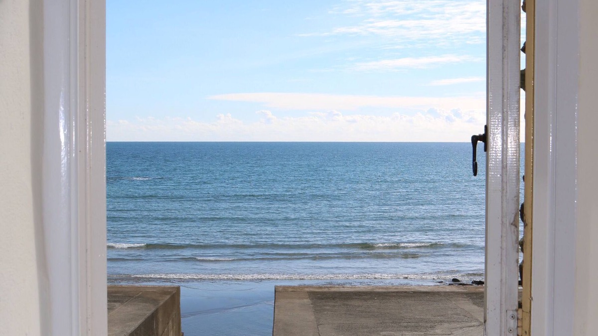 Portholland Cottage | Wonderful reverse level conversion located on the sea front in picturesque rural hamlet on the South