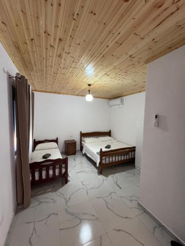 Koman House | Xhoen Haven